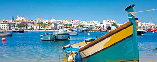 beach and boat in west algarve town