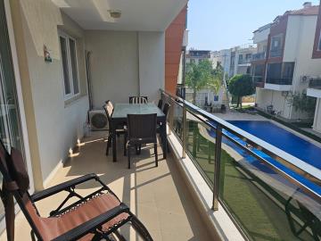 spacious-balcony-overlooking-pool-and-garden-areas