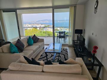 tastefully-furnished-living-area-with-access-to-sea-view-balcony