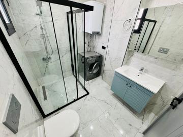 modern-fully-tiled-bathroom