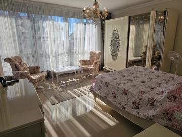 nicely-furnished-bedroom-with-access-to-balcony