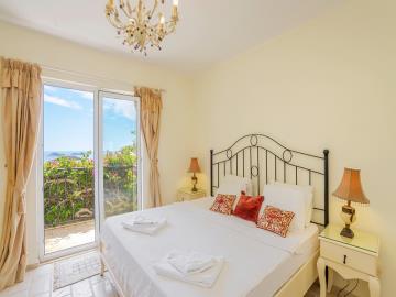 beautifully-furnished-bedroom-with-sea-view-balcony