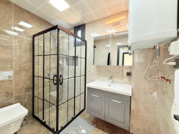 fully-tiled-family-bathroom