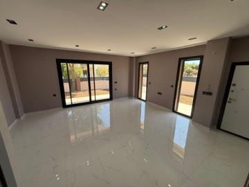 large-living-area-with-access-to-outside-space