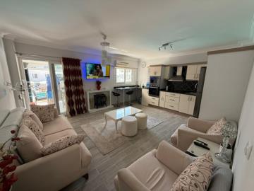 Lounge-leading-to-glassed-in-balcony