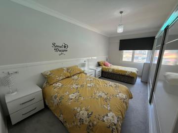 Main-bedroom-with-space-for-a-double-and-single-bed