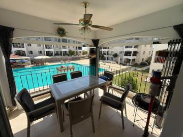 Spacious-balcony-overlooking-pool