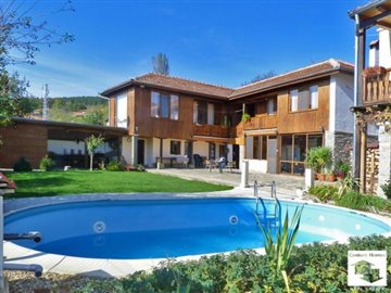 two houses with ? pool in a common yard