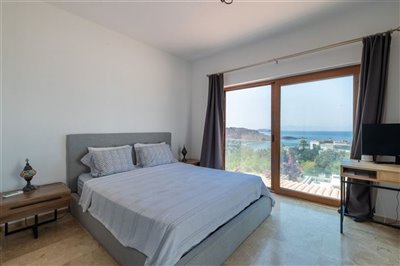 Luxurious unique villa in Gumusluk For Sale – Spacious double bedroom with stunning views