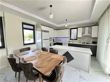 Impressive 3-Bedroom Villa In Dalyan For Sale - Modern dining area through to kitchen