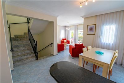 Luxury triplex Villa For Sale In Fethiye - Dining area with stairs to first floor