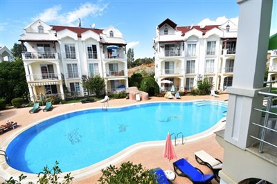 2 Bed Apartment In Fethiye For Sale - View over modern apartment complex and pool