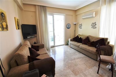 2 Bed Apartment In Fethiye For Sale - Lounge leading to the balcony