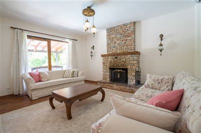 Beautiful Gocek Stone Villa For Sale - Cosy lounge with stone fireplace