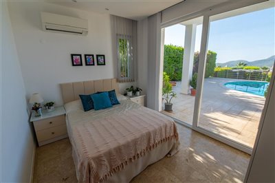 Exquisite Fethiye Detached Villa In Ovacik With A Private Pool For Sale - Lovely bedroom with pool access