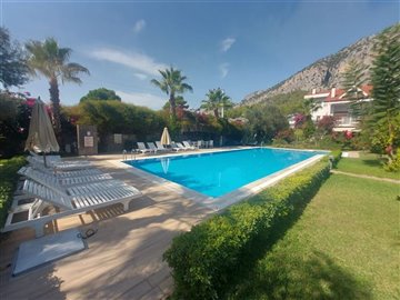 Beautiful Duplex Garden Apartment  in Gocek For Sale - Main view of communal gardens and pool