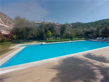 Beautiful Duplex Garden Apartment  in Gocek For Sale - Large communal swimming pool