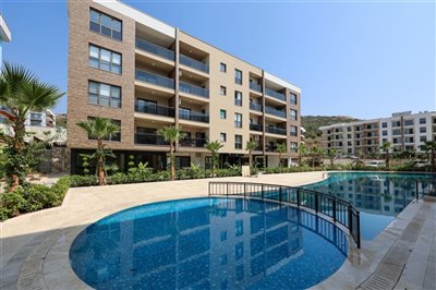 Newly Built Kusadasi Apartments with On-Complex Facilities for Sale - Communal pool with sun terraces