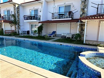 Stylish four-bedroom Duplex Apartment in Dalyan For Sale - Pretty apartment block and pool