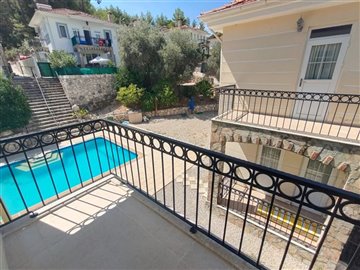 Rural Detached Fethiye Property For Sale - Bedroom balcony with pool and terrace views