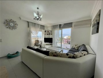Notable Alanya Property For Sale – Modern lounge with balcony access