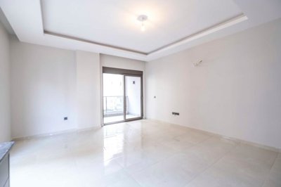 Modern Newly-Built Alanya Property For Sale – Living room with access to the balcony