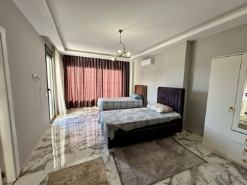 Unique Smart Home Property For Sale In Alanya - Vast bedroom with balcony access