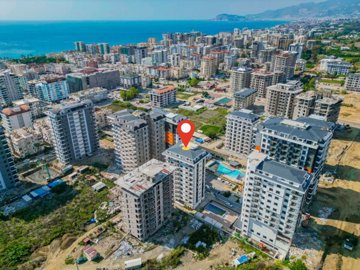 Newly Built, Modern Alanya Property For Sale – View to apartment block close to the sea