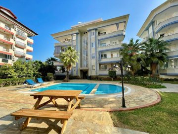 Impeccable Alanya Apartment For Sale – Main view of apartment with communal pool