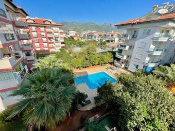 Impeccable Alanya Apartment For Sale – Views from the balcony down to the communal pool