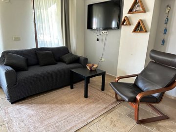 Riverside Dalyan Duplex Apartment For Sale - Lounge area with TV