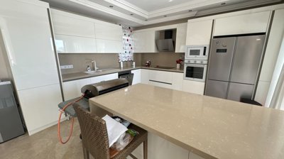 Idyllic Detached Villa For Sale in Belek, Antalya - Modern, crisp white, fully fitted kitchen