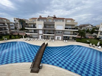 Spacious Duplex Apartment For Sale in Antalya - Main view of complex building and pool