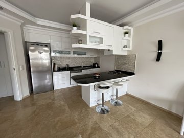 Spacious Duplex Apartment For Sale in Antalya - Fully equipped and furnished kitchen