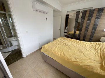 Light-Filled Apartment In Belek For Sale - Furnished double bedroom with air conditioning