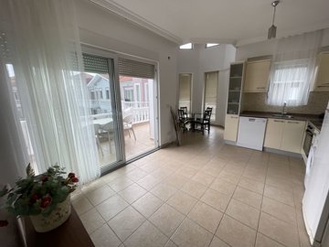 Light-Filled Apartment In Belek For Sale - Lounge through to the dining space and kitchen