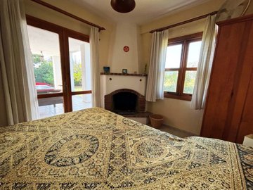 Charming Private Dalyan Property For Sale - Double bedroom with fireplace