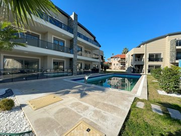 Delightful Duplex Belek Apartment For Sale - Huge sun terraces encompassing the pool