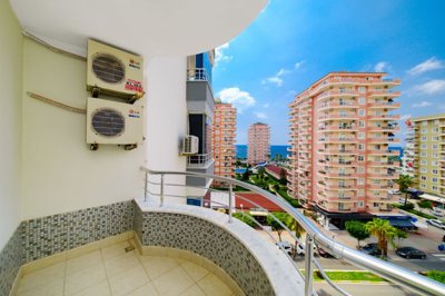 A Chic Sea View Apartment For Sale in Mahmutlar, Alanya - Balcony with surrounding and sea views