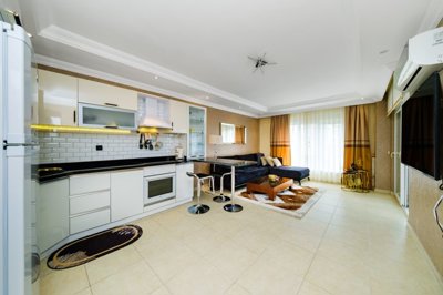 A Chic Sea View Apartment For Sale in Mahmutlar, Alanya - Modern, fully furnished, open-plan living space