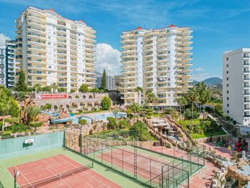 A Must-See Alanya Property For Sale – View of apartment blocks and tennis courts on-site