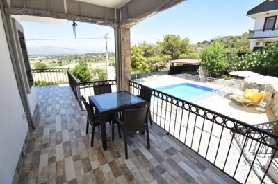 Charming 3-Bed Fethiye Property For Sale - Huge balcony with views over the pool and across nature