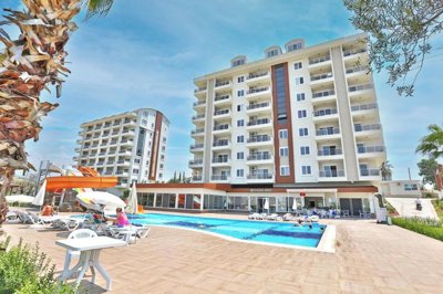 A Pristine Apartment For Sale In Avsallar - Apartment blocks and communal pool