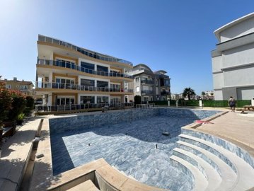 Expansive Duplex Apartment For Sale In Belek - Main view to apartment and shared pool