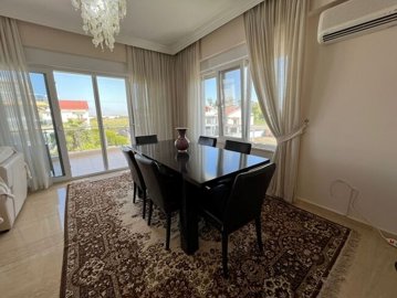 Expansive Duplex Apartment For Sale In Belek - Lovely dining space with views to the gardens