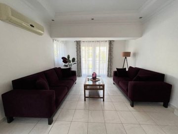 Delightful Triplex Villa In For Sale In Belek - Furnished lounge space with access to garden