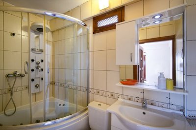 Pristine Sea View Villa For Sale In Yalikavak – Modern luxurious bathroom with multi-functional shower cabin