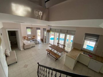 A beautiful Detached Golf Villa in Antalya For Sale - View from the staircase down to the open-plan living space