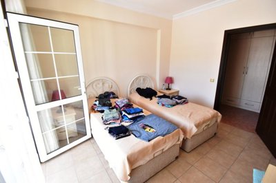 Must-See Garden Floor Apartment In Fethiye For Sale - Spacious double bedroom with twin beds