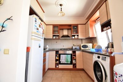 Must-See Garden Floor Apartment In Fethiye For Sale - Fully fitted kitchen with white goods